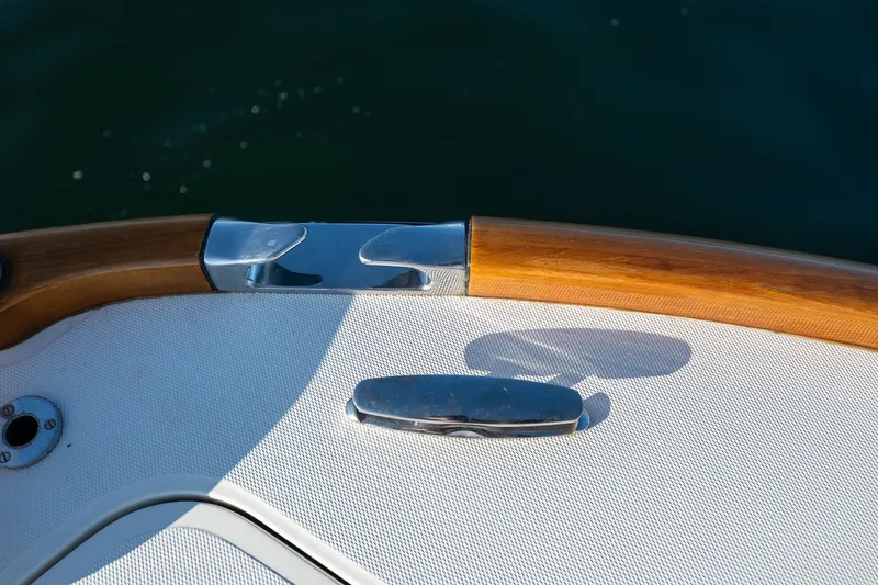 Slide: The Image of 2008 Hinckley Talaria 29R boat detail with polished wood and metal accents. - 12
