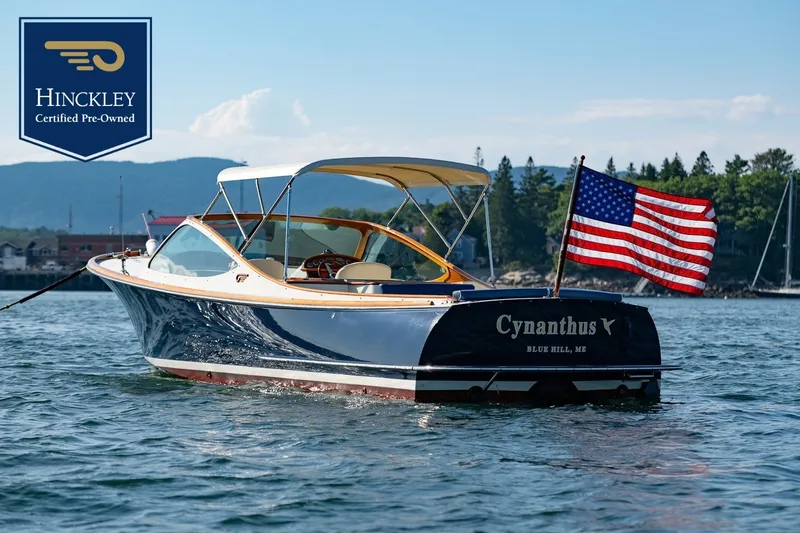 The Image of A sleek 2008 Hinckley Talaria 29R on the water with an American flag. - 0