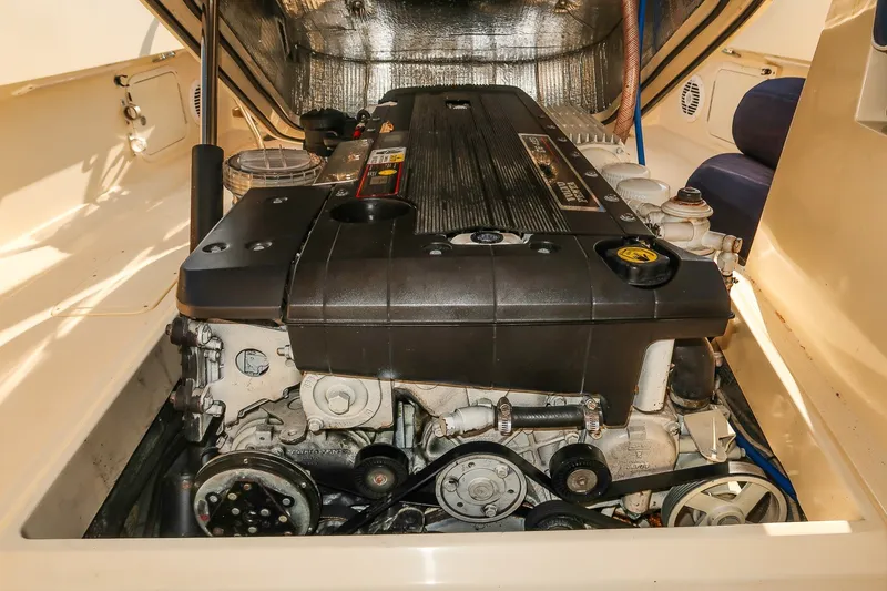 Slide: The Image of Engine compartment of a 2008 Hinckley Talaria 29R boat, showcasing detailed mechanics. - 30