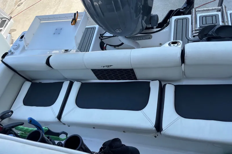 Slide: The Image of 2025 Tidewater 210 LXF boat interior with seating and fishing equipment. - 15