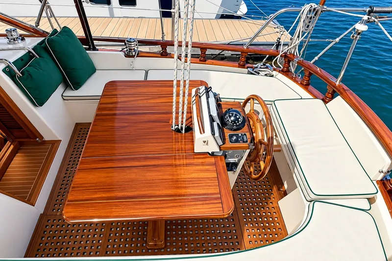 Slide: The Image of Luxurious 1988 Gozzard Cutter 36 yacht cockpit with wooden table and helm. - 15