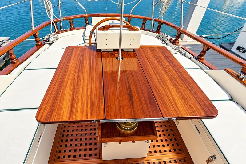 Slide: The Image of Elegant wooden deck of 1988 Gozzard Cutter 36 sailboat with polished table. - 11