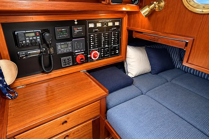 Slide: The Image of Cozy cabin interior of 1988 Gozzard Cutter 36 with control panel and seating area. - 16