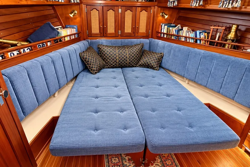 Slide: The Image of Luxurious interior of 1988 Gozzard Cutter 36 with blue upholstery and wooden accents. - 22