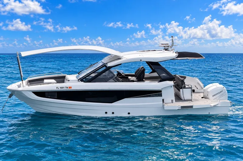 Slide: The Image of 2023 Galeon 325 GTO luxury yacht cruising on clear blue ocean waters. - 4