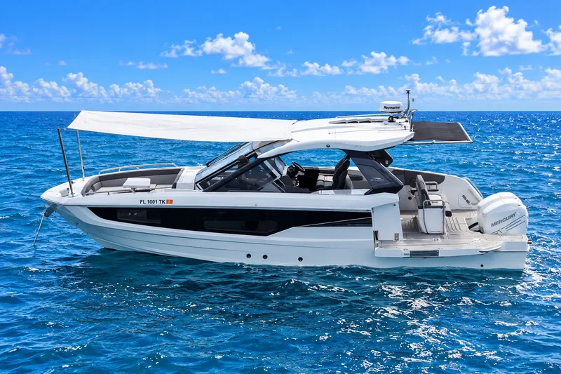 The Image of 2023 Galeon 325 GTO luxury yacht cruising on clear blue ocean waters. - 1