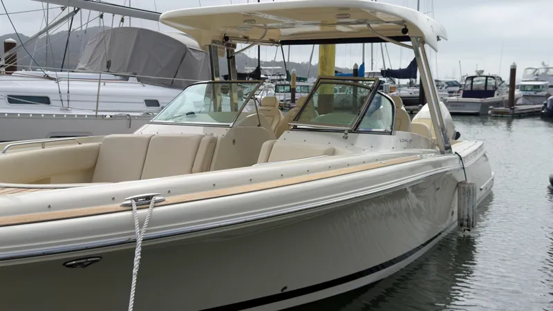 Slide: The Image of 2022 Chris-Craft Calypso 30 docked, featuring elegant design and beige interior. - 18