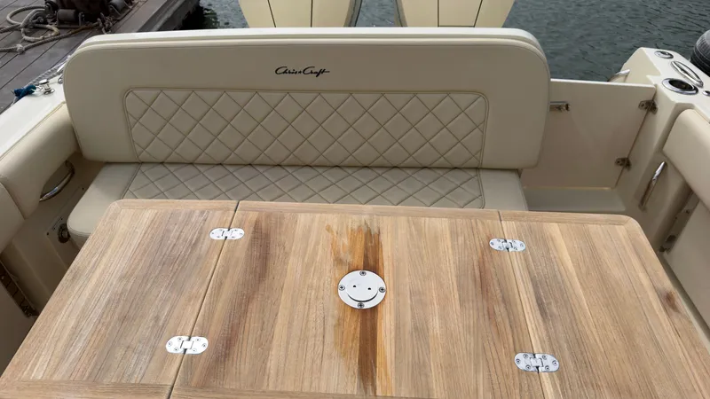 Slide: The Image of The image shows the interior of a Chris-Craft Calypso 30 boat with an elegant wood finish. - 4