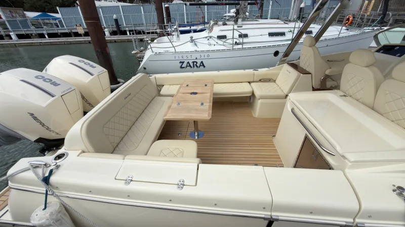 Slide: The Image of The image shows the cockpit of a 2022 Chris-Craft Calypso 30 with beige seating. - 5