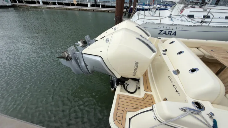 Slide: The Image of A 2022 Chris-Craft Calypso 30 with twin Mercury outboard engines at the dock. - 8