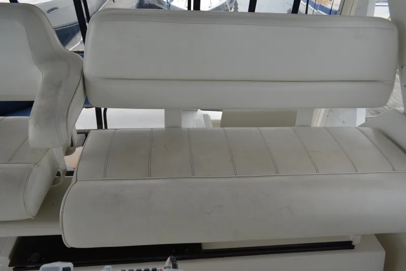 Slide: The Image of White seating on 2000 Carver 356 Aft Cabin Motor Yacht, showcasing helm area. - 21