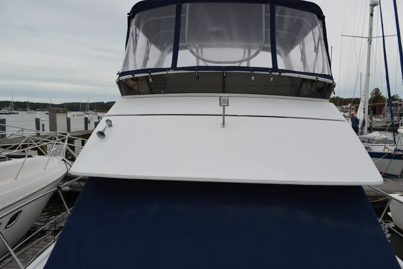 Slide: The Image of 2000 Carver 356 Aft Cabin Motor Yacht docked at marina, front view. - 8