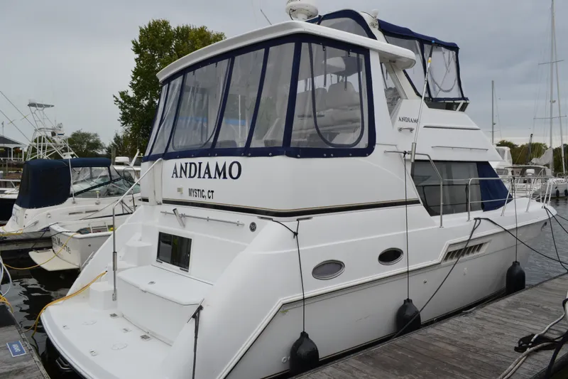 Slide: The Image of Carver 356 Aft Cabin Motor Yacht 2000 docked, featuring spacious aft cabin and sleek design. - 0