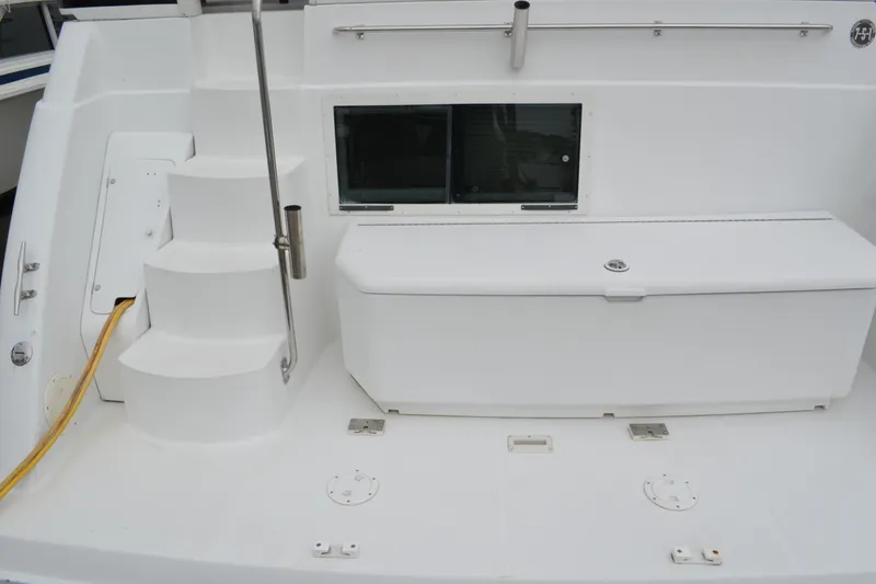 Slide: The Image of 2000 Carver 356 Aft Cabin Motor Yacht deck with steps and storage compartment. - 2