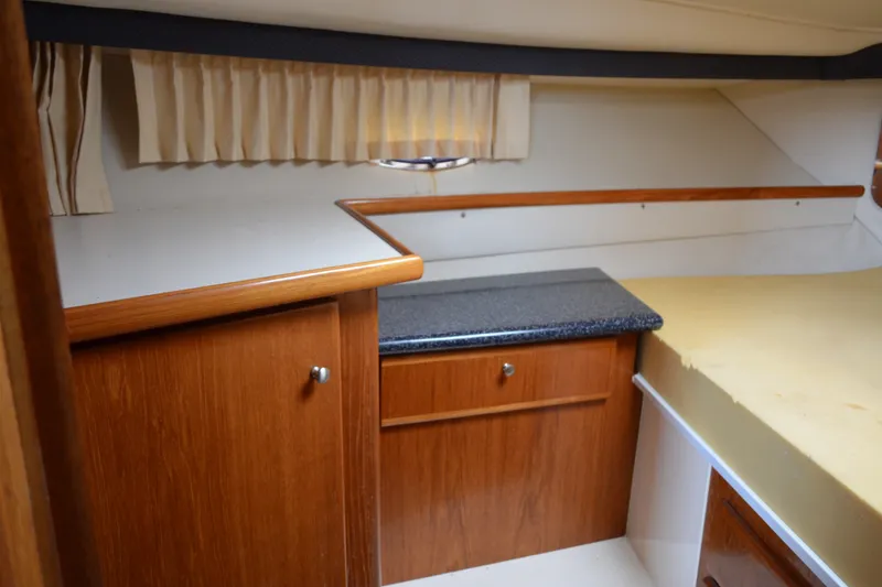 Slide: The Image of Interior of 2000 Carver 356 Aft Cabin Motor Yacht with wood cabinetry and countertop. - 42