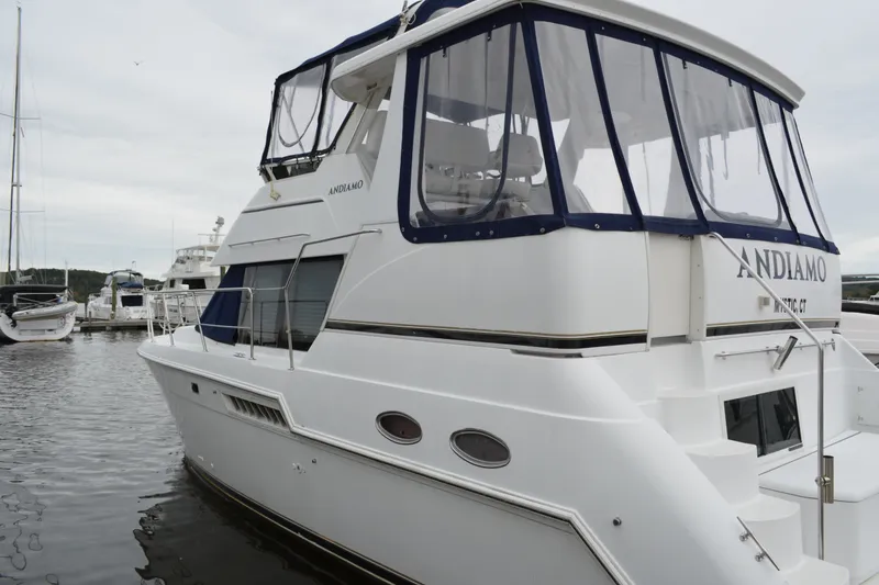 The Image of 2000 Carver 356 Aft Cabin Motor Yacht docked at marina. - 4