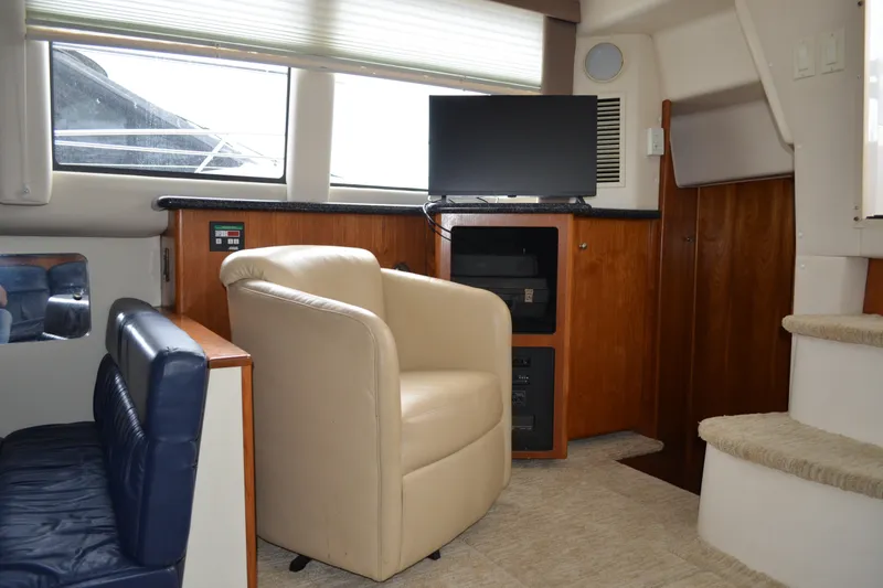 Slide: The Image of Interior of 2000 Carver 356 Aft Cabin Motor Yacht with seating and TV. - 29