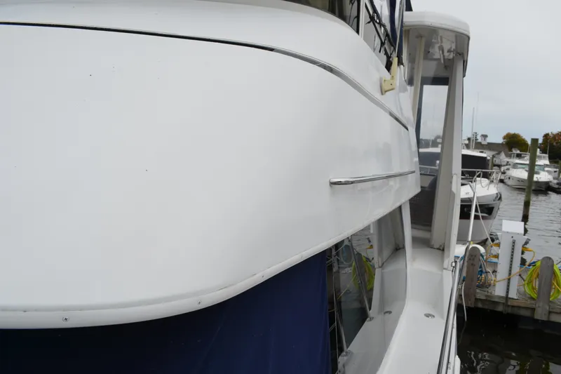 Slide: The Image of 2000 Carver 356 Aft Cabin Motor Yacht docked at marina, side view. - 10