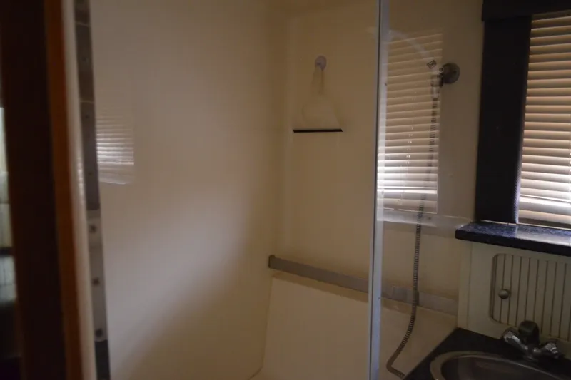 Slide: The Image of Bathroom interior of 2000 Carver 356 Aft Cabin Motor Yacht with shower and sink. - 53