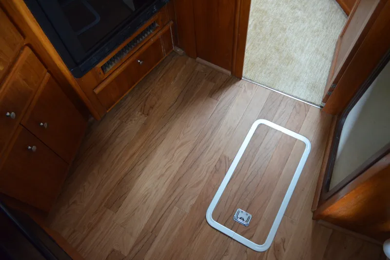 Slide: The Image of Interior of 2000 Carver 356 Aft Cabin Motor Yacht with wood flooring and cabinetry. - 36