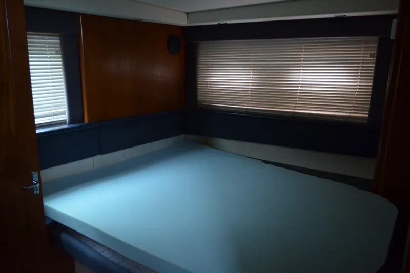 Slide: The Image of Interior cabin of 2000 Carver 356 Aft Cabin Motor Yacht with bed and blinds. - 49
