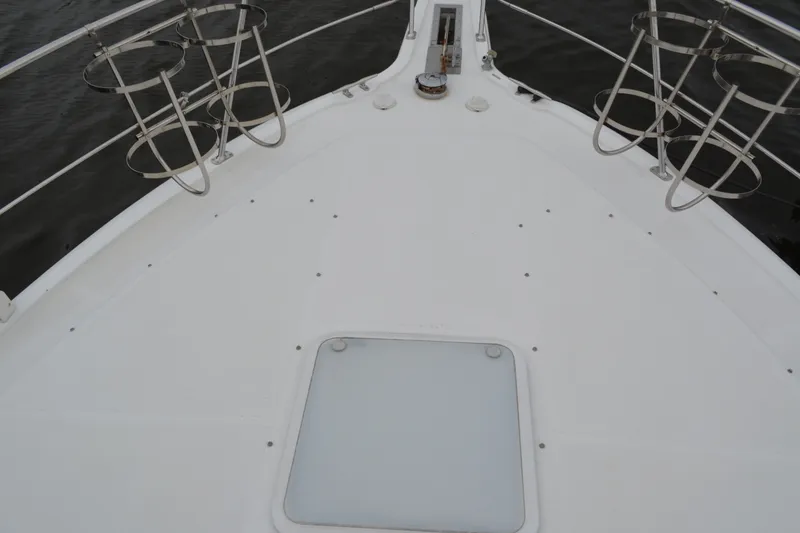 Slide: The Image of Bow deck of 2000 Carver 356 Aft Cabin Motor Yacht with stainless steel railings. - 7