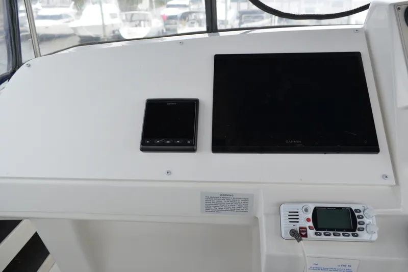 Slide: The Image of Control panel of a 2000 Carver 356 Aft Cabin Motor Yacht with Garmin navigation. - 23