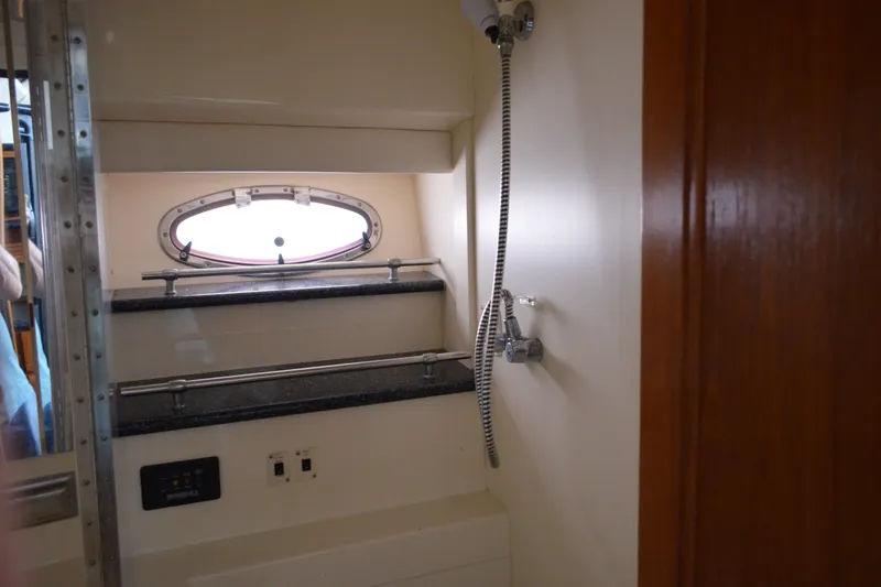 Slide: The Image of Interior of 2000 Carver 356 Aft Cabin Motor Yacht with porthole and shower fixtures. - 39