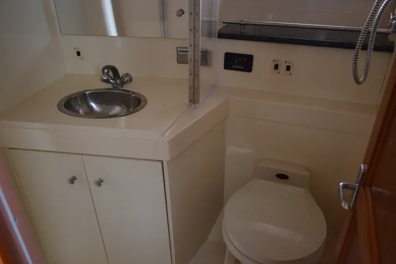 Slide: The Image of Bathroom interior of 2000 Carver 356 Aft Cabin Motor Yacht with sink and toilet. - 38