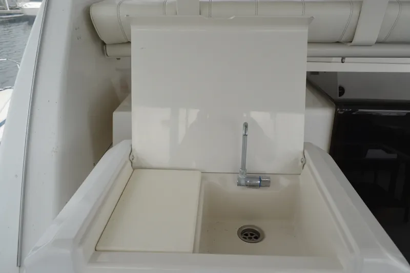 Slide: The Image of Sink area on 2000 Carver 356 Aft Cabin Motor Yacht, featuring a compact design. - 14