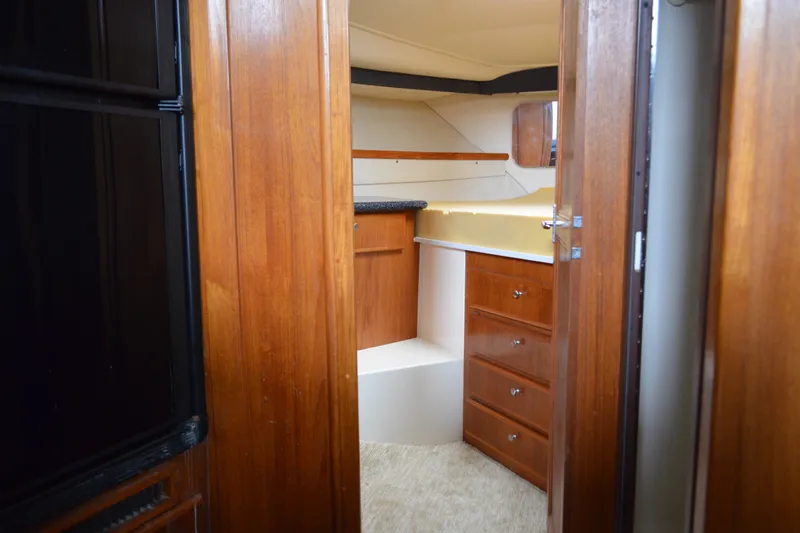 Slide: The Image of Interior of 2000 Carver 356 Aft Cabin Motor Yacht with wood cabinetry and countertop. - 41