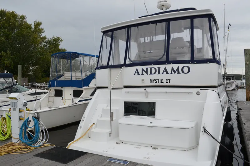 Slide: The Image of 2000 Carver 356 Aft Cabin Motor Yacht docked, named "Andiamo" in Mystic, CT. - 1