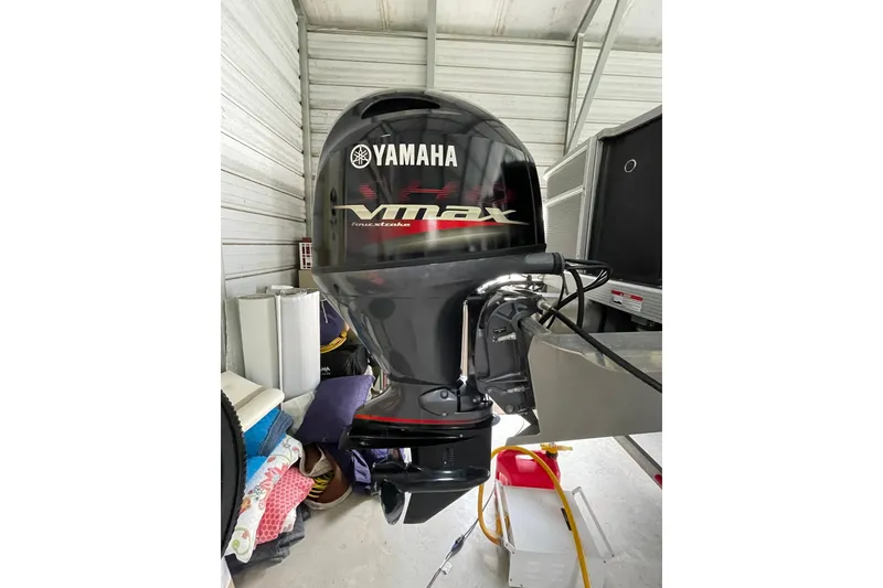 Slide: The Image of 2023 Bennington 20 SS with Yamaha VMAX outboard motor in storage. - 15