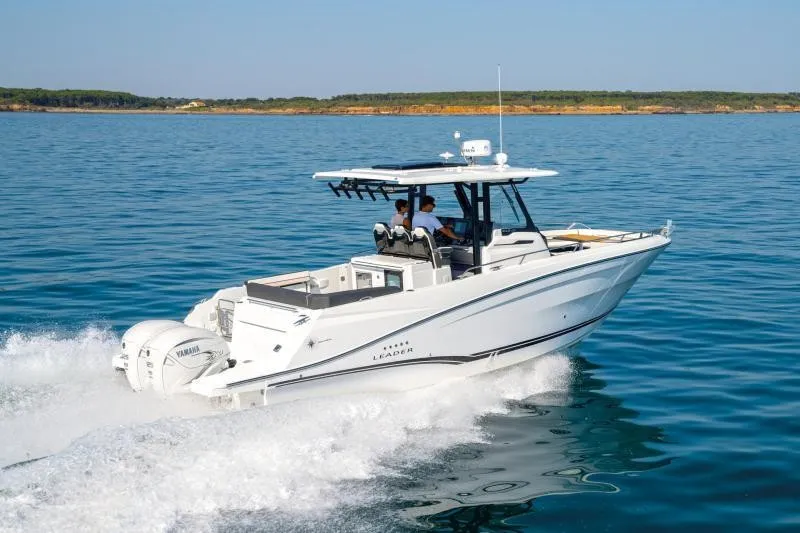 Slide: The Image of A modern motorboat speeds across calm water, with a clear coastline in the background. - 19