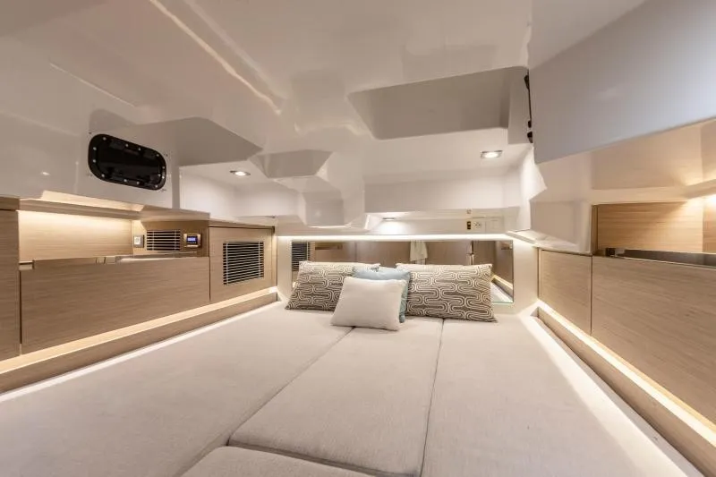 Slide: The Image of Interior of a modern yacht with sleek wood accents and cozy cushions. - 21