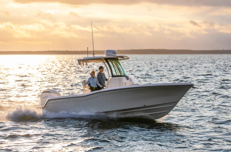 Slide: The Image of A Grady-White Fisherman 216 boat cruising on the water at sunset. - 1