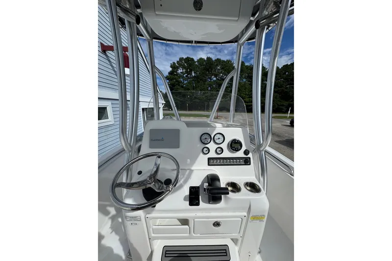 Slide: The Image of 2020 Tidewater 198 CC Adventure boat console with steering wheel and gauges. - 5