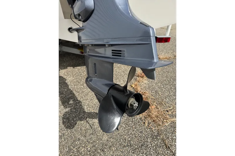 Slide: The Image of Outboard motor of 2020 Tidewater 198 CC Adventure boat on pavement. - 14