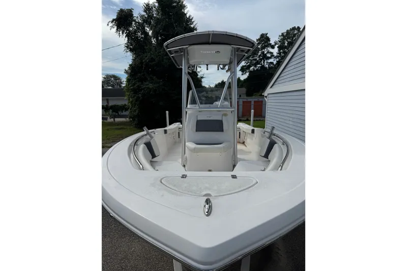 The Image of 2020 Tidewater 198 CC Adventure boat with T-top and seating, parked outdoors. - 0
