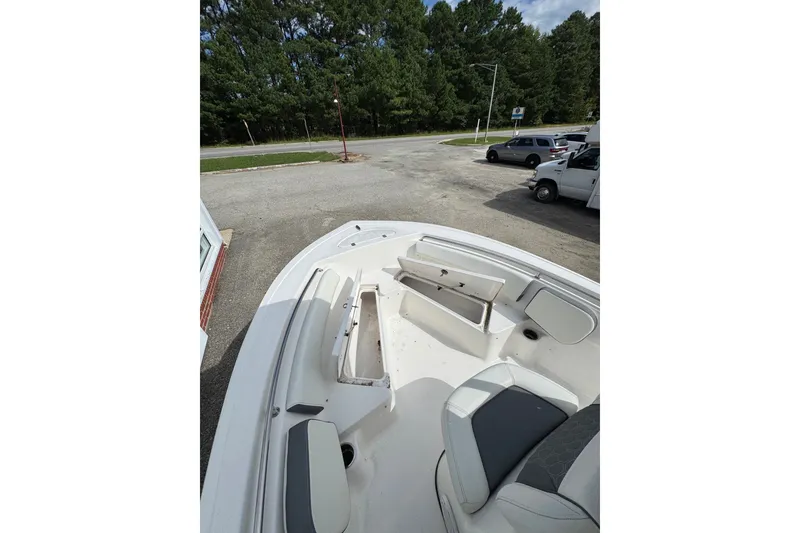 Slide: The Image of 2020 Tidewater 198 CC Adventure boat interior with seating and storage compartments. - 2