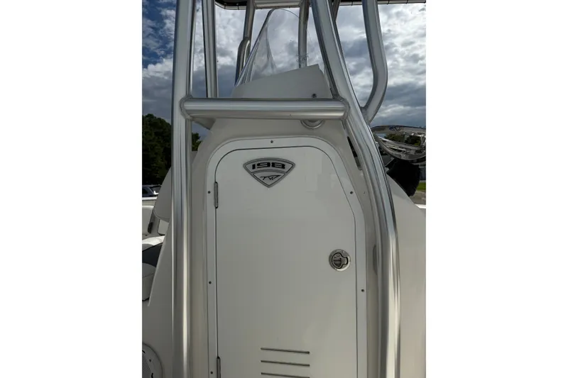 Slide: The Image of 2020 Tidewater 198 CC Adventure boat console with sleek design and sturdy frame. - 3