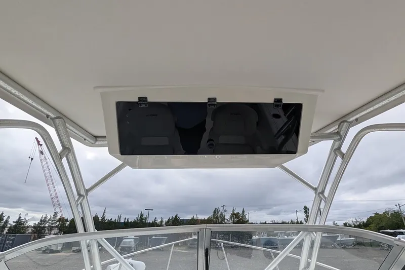 Slide: The Image of 2012 Sea Fox 216 Walk Around boat interior view with overhead storage compartment. - 9