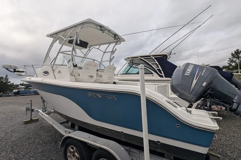 Slide: The Image of 2012 Sea Fox 216 Walk Around boat on trailer, featuring Yamaha outboard motor. - 20