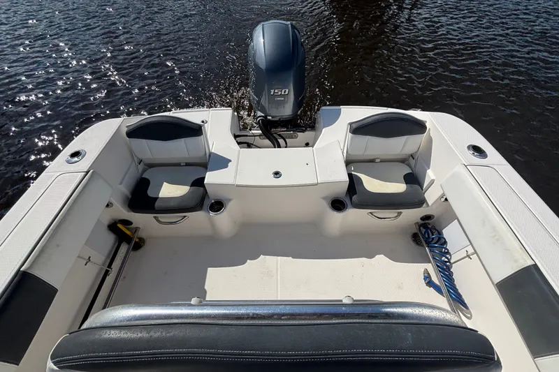 Slide: The Image of 2020 Robalo R200 Center Console boat interior with seating and outboard motor. - 15