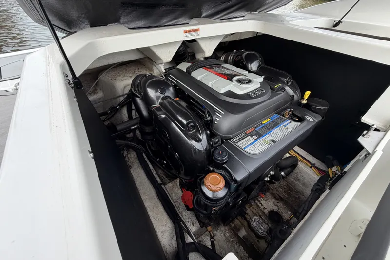 Slide: The Image of Engine compartment of a 2019 Monterey M-22 boat, featuring a Mercury 250 engine. - 32