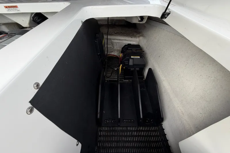 Slide: The Image of 2019 Monterey M-22 boat interior showing battery compartment and storage area. - 33