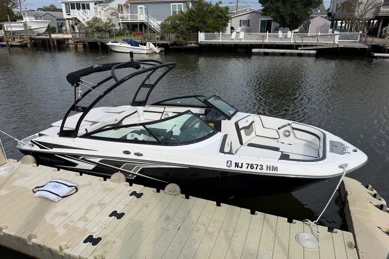 The Image of 2019 Monterey M-22 boat docked by a waterfront home. - 14