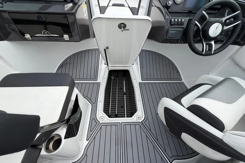 Slide: The Image of 2019 Monterey M-22 boat interior with sleek seating and modern dashboard design. - 34