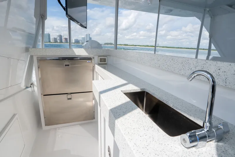 Slide: The Image of Luxurious 2018 Hatteras M75 Panacera yacht kitchen with modern sink and stainless steel appliances. - 15