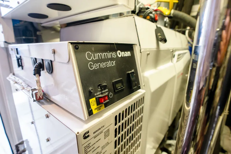Slide: The Image of Cummins Onan generator inside 2018 Hatteras M75 Panacera yacht engine room. - 62
